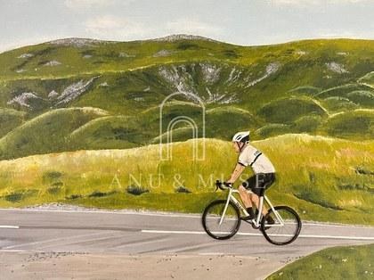 A cyclist in motion on an open road, in hand-modelled clay relief and acrylic
