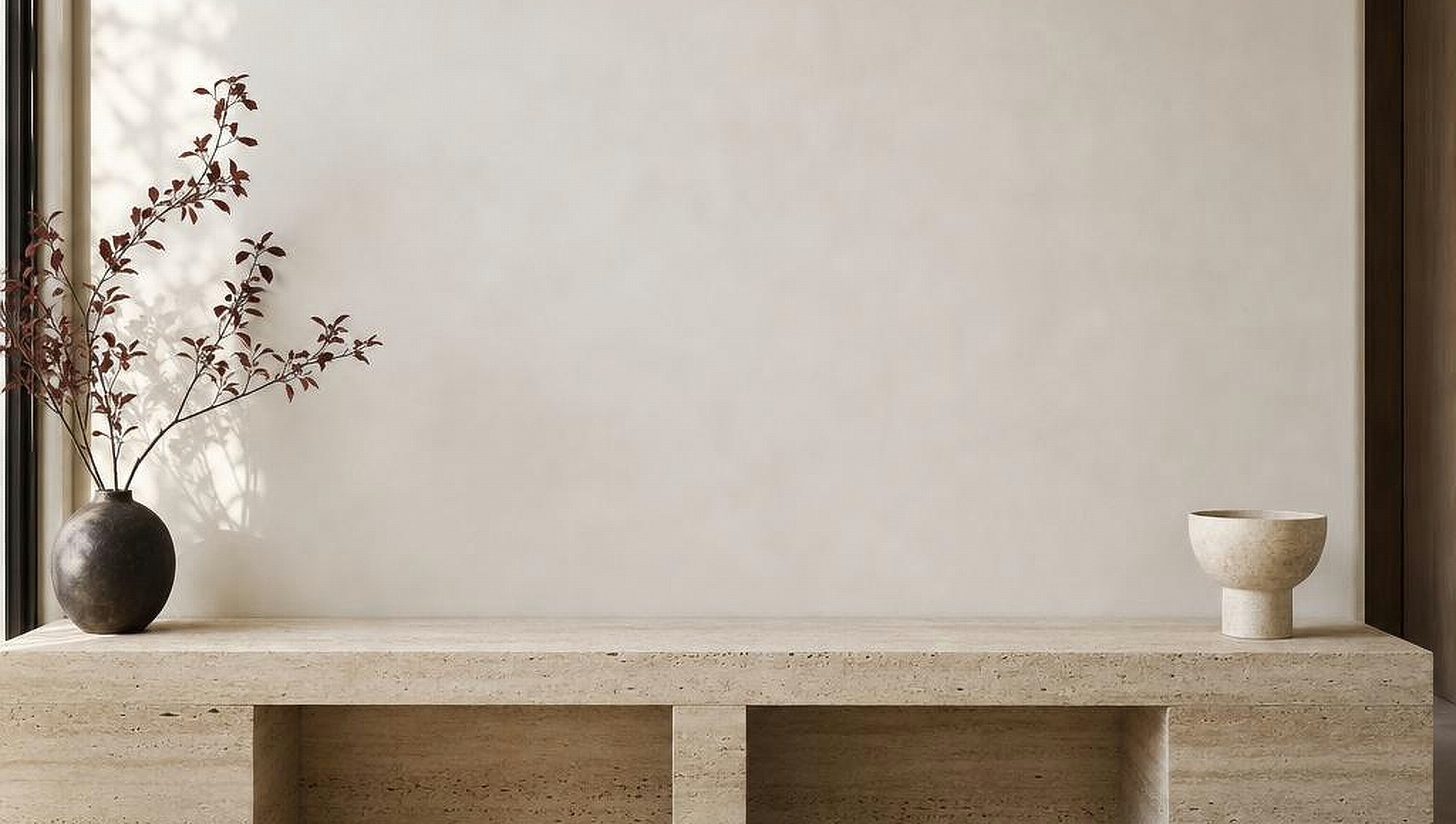 Sunlit ivory-plaster living room, travertine bench, illustrative room setting